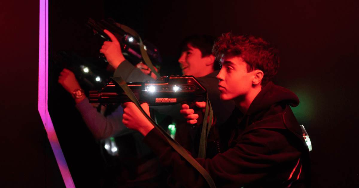 Young Boys Taking Aim At Laser Tag (1)