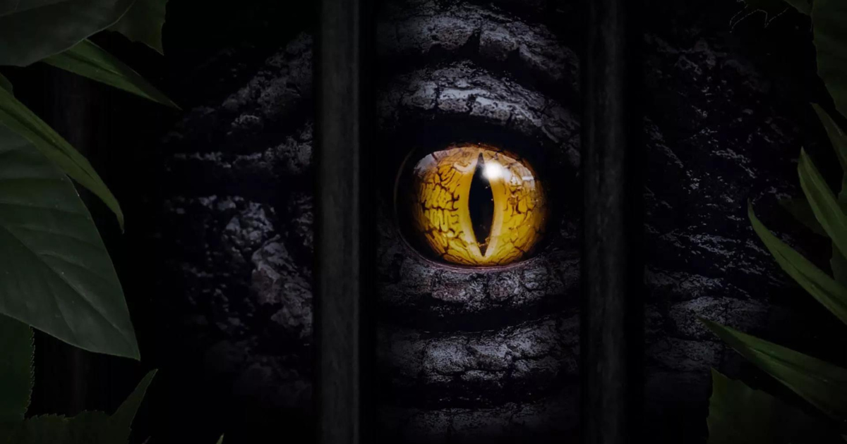 Dinosaur Eye Looking Through A Metal Cage