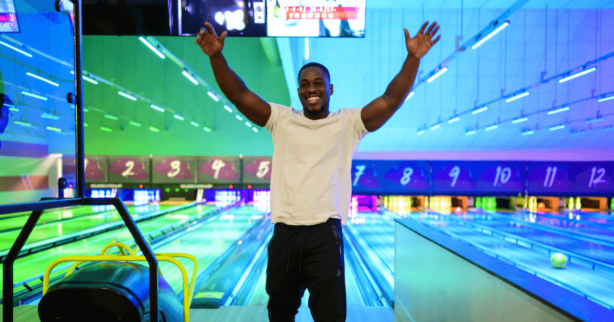 Man Celebrating With Bowling Lane In Background (1) (1)