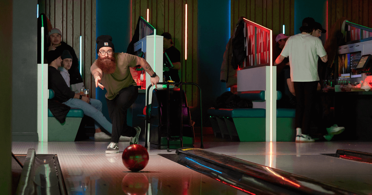 Young Man Performing The Hook Technique In Bowling (1)