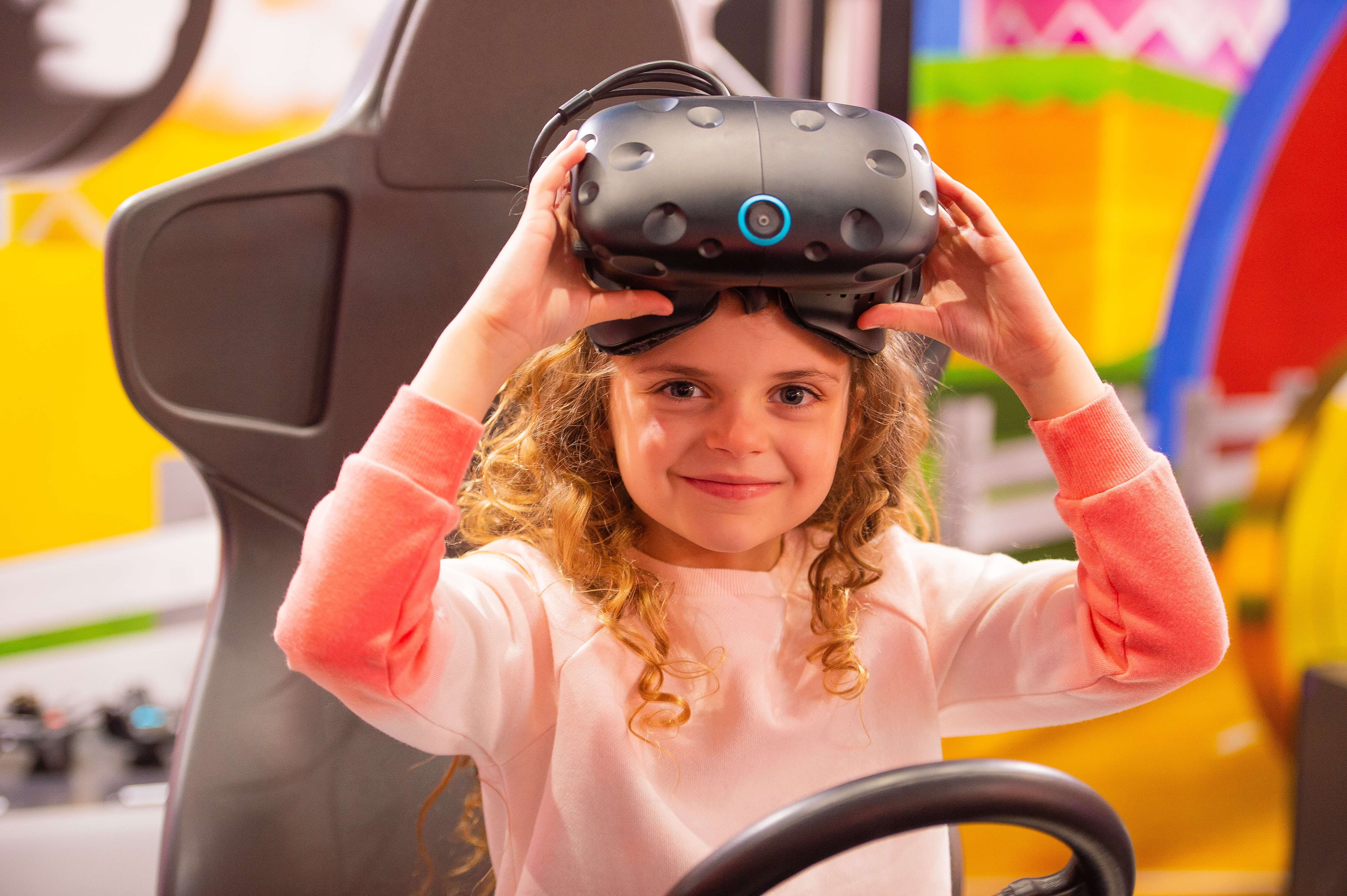 Girl Playing Virtual Reality Arcade Game