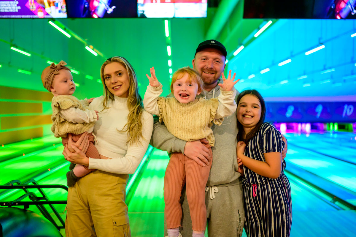 Family Having Fun Tenpin Arcade