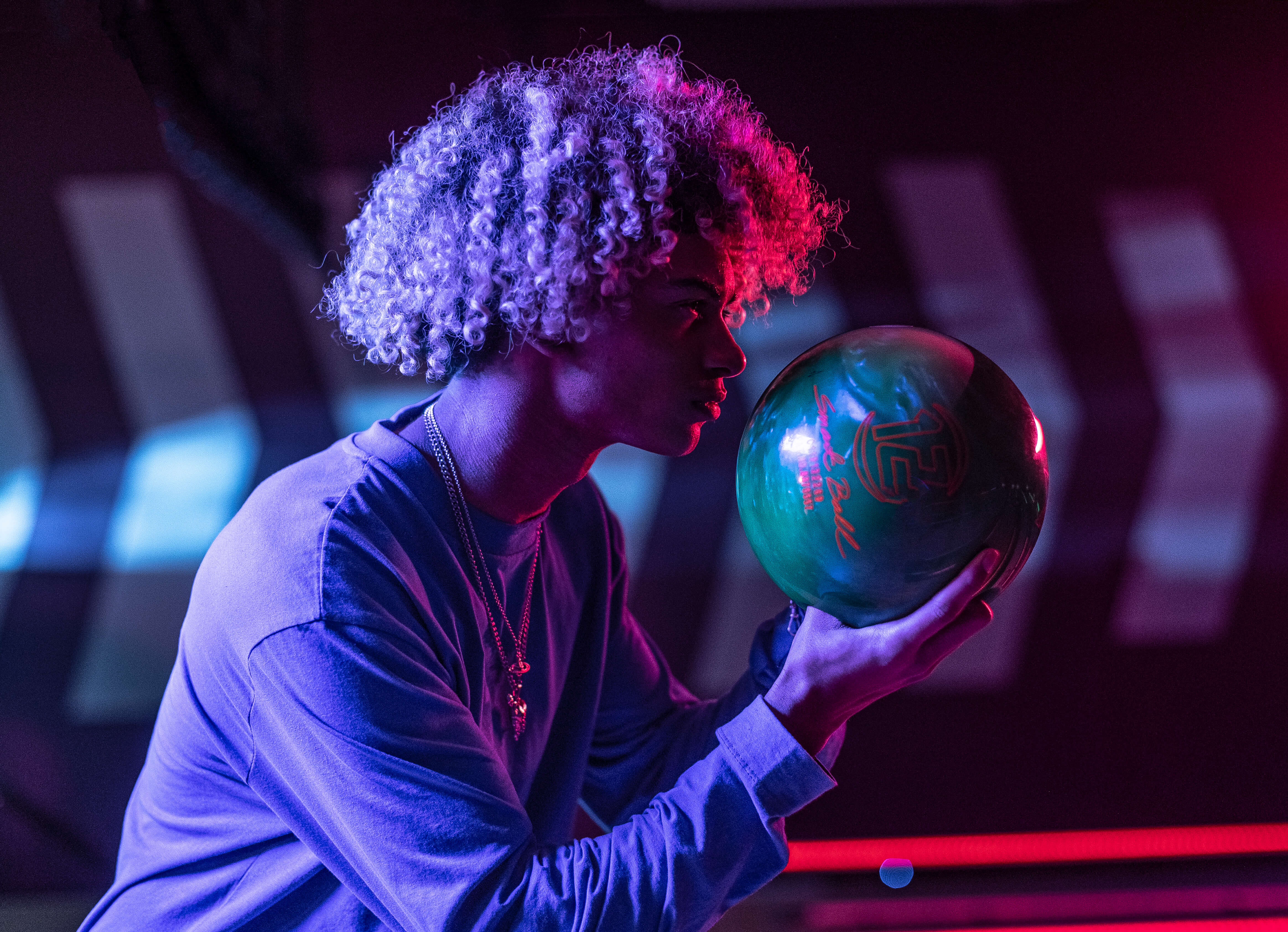 Teenage Boy Holding Bowling Ball