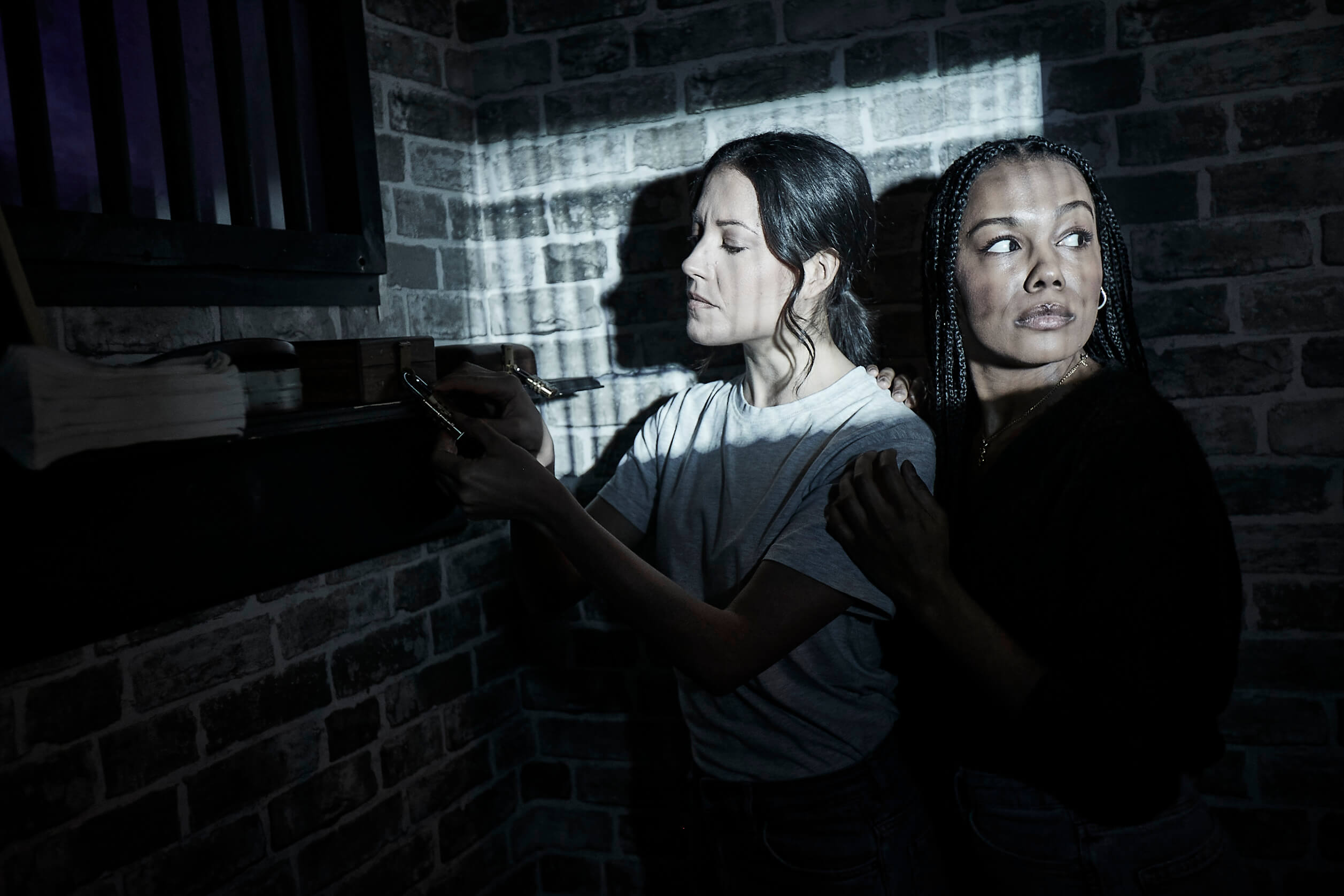 Two Women In Dark Escape Room Tenpin 11