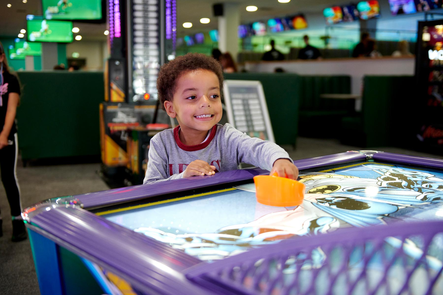 Boy Playing Air Hockey