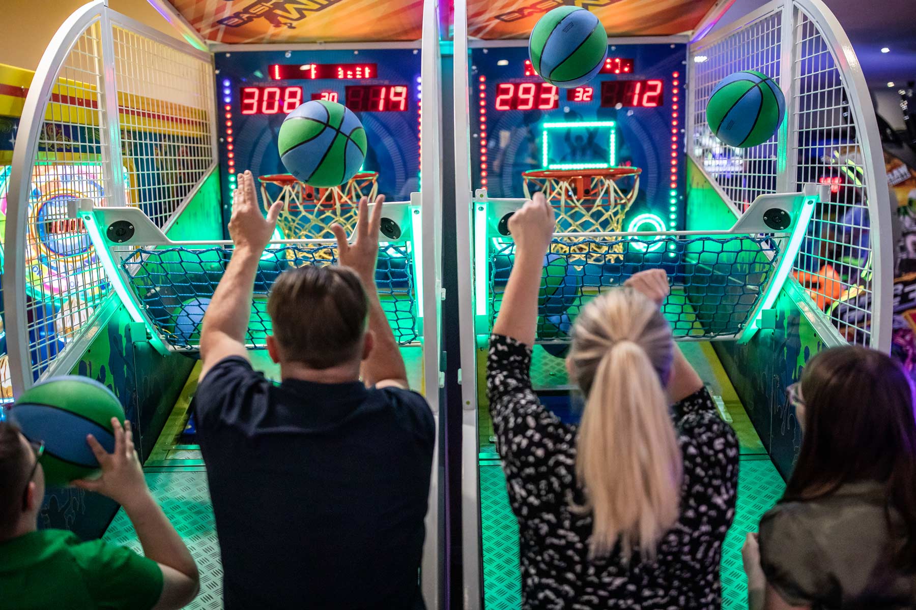 Familly Playing Basketball Game In Tenpin Bexleyheaths Arcade