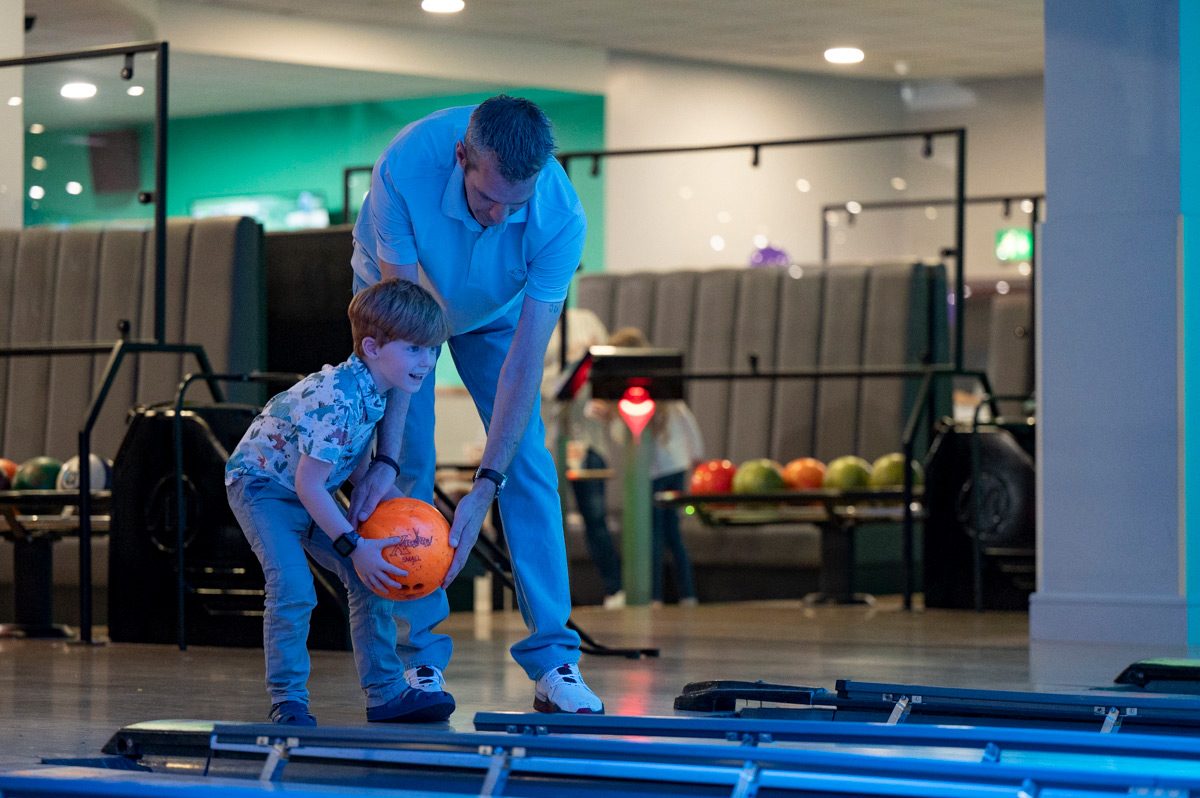 Father Helping Son Bowl In Northampton