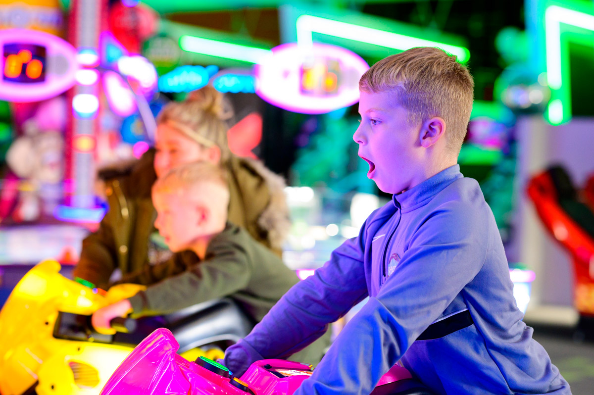 Boy Riding Motorcycle In Arcade
