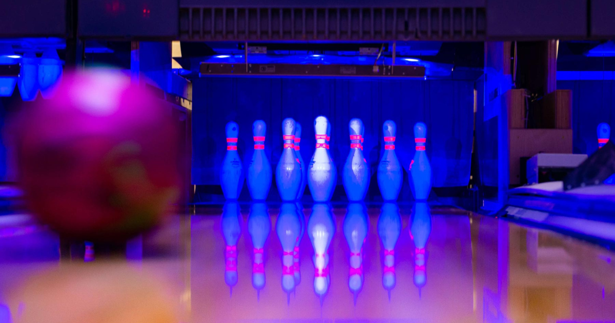 bowling ball just about to hit the pins