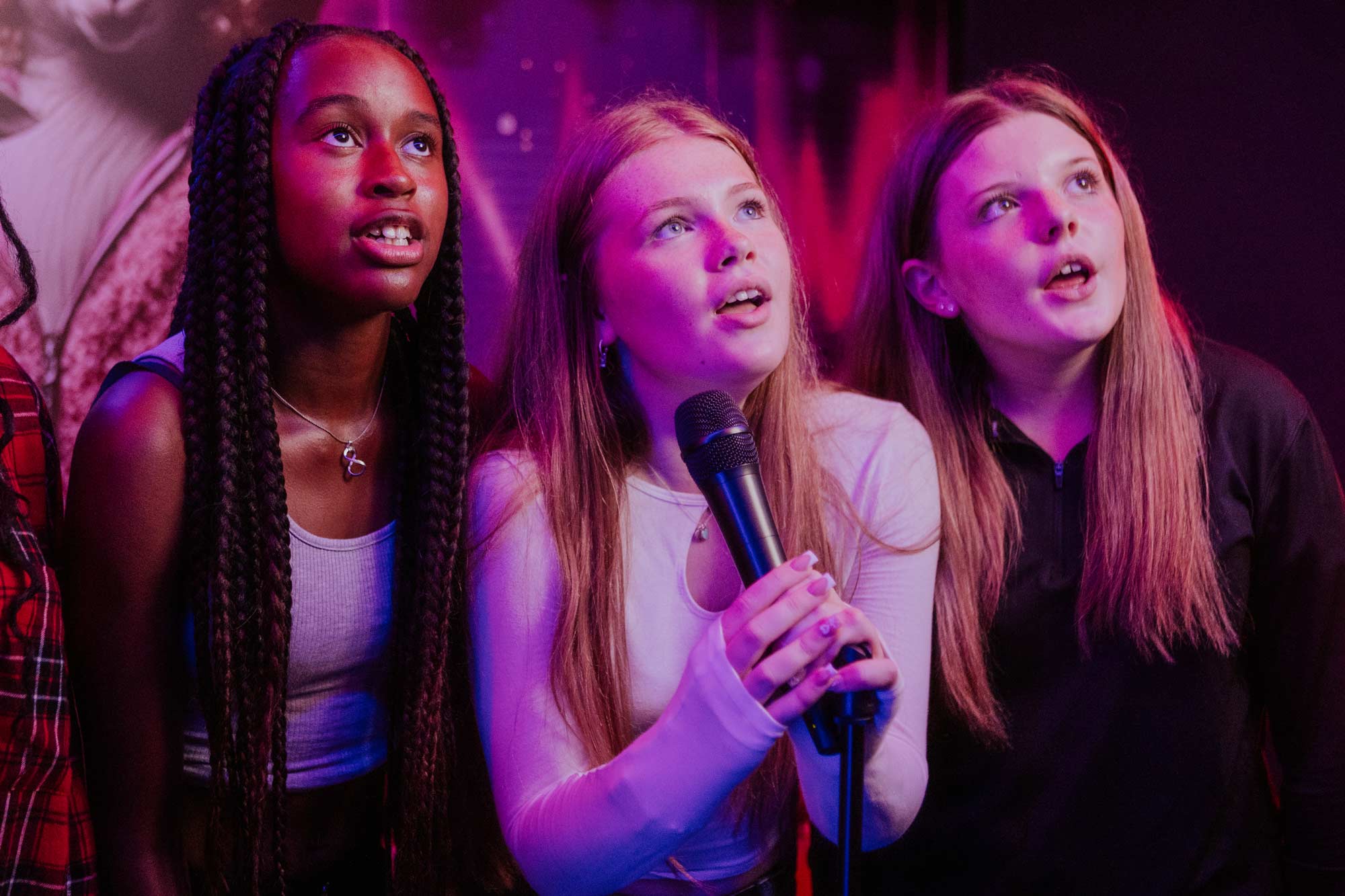 Friends singing karaoke