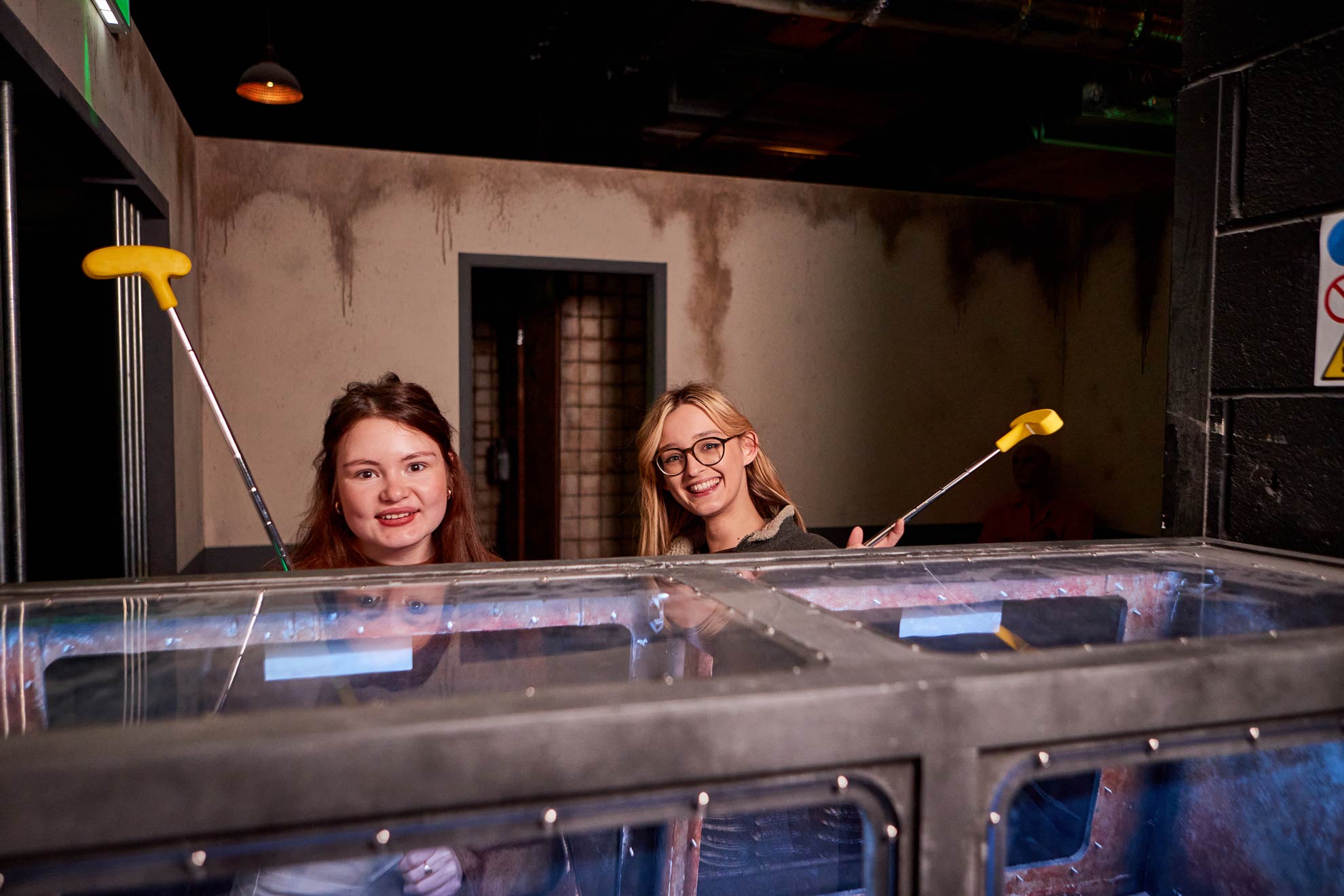 2 Friends In The Prison Putt Crazy Golf Experience