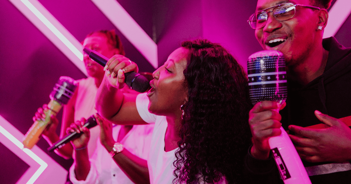 A Group Of Friends Singing In A Karaoke Room (1)