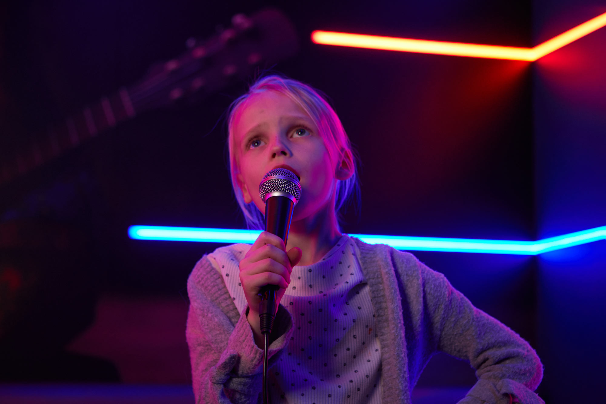 Little girl singing karaoke in Tenpin Acton karaoke room
