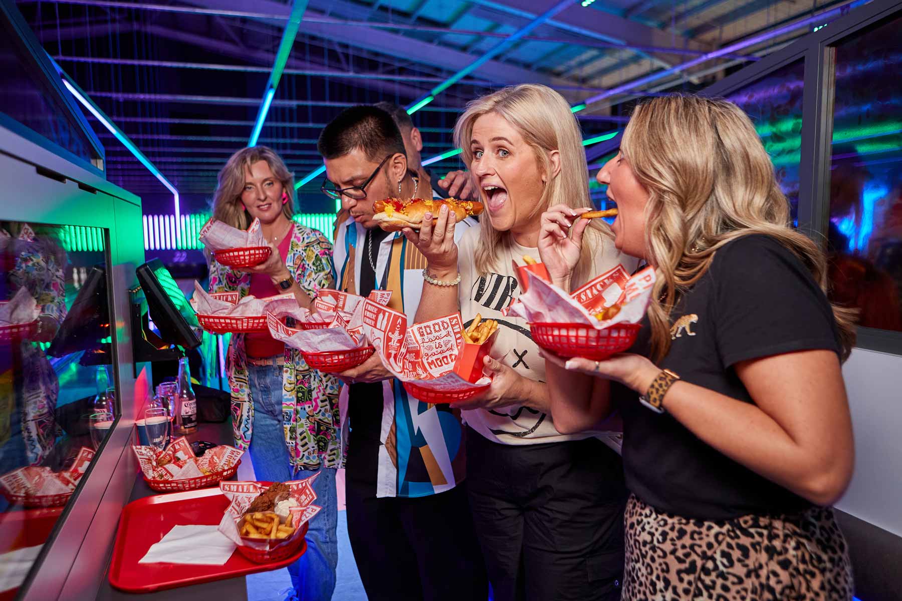 Dundee bowling group of friends eating on lanes