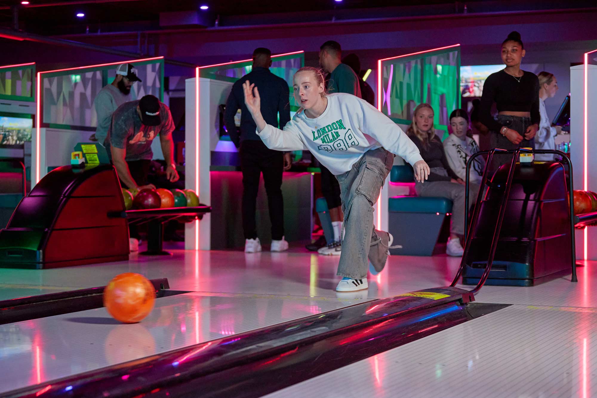Bowling Sheffield young woman taking ten pin bowling turn