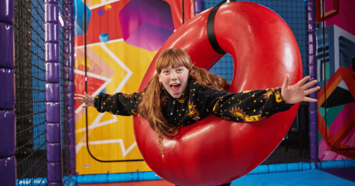 Young Girl Standing In A Red Ring At Tenpin Soft Play (1)