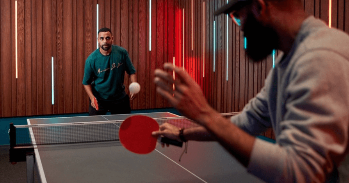 Two Men Playing Table Ten One Serving To The Other (1)