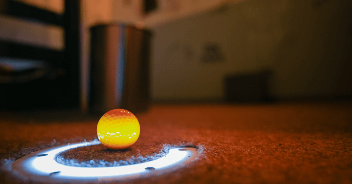 Yellow Golf Ball Inside An Illuminated Horse Shoe (1)