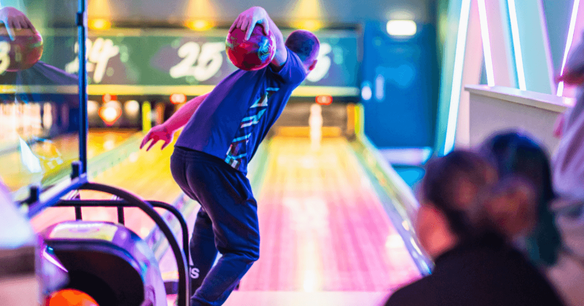 Professional Bowler Ready To Roll Ball Down Lane (1)