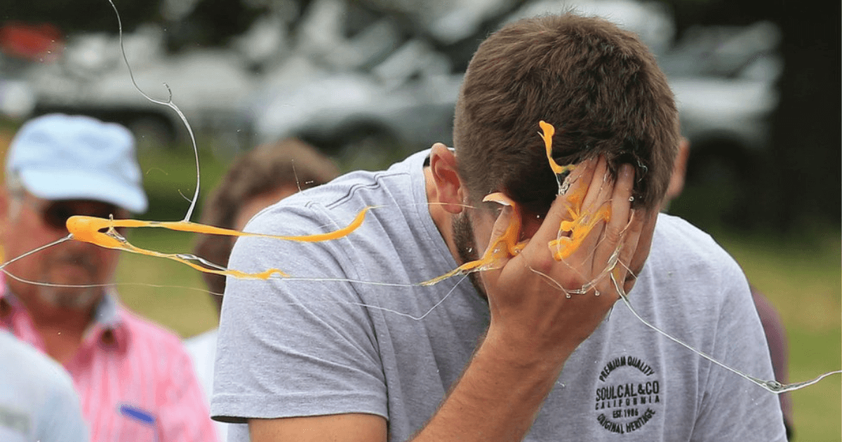 A Man Cracking A Soft Boiled Egg On His Head (1)