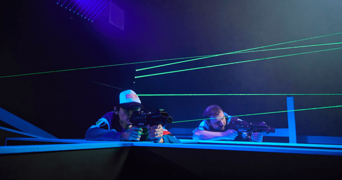 Green Laser Tag Beams While 2 Players Point Laser Tag Guns (1)