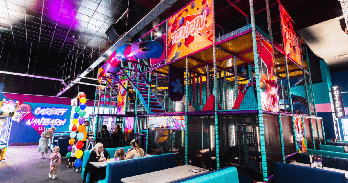Tenpin Softplay Area In Bright Colours With People Sitting At Tables (1)