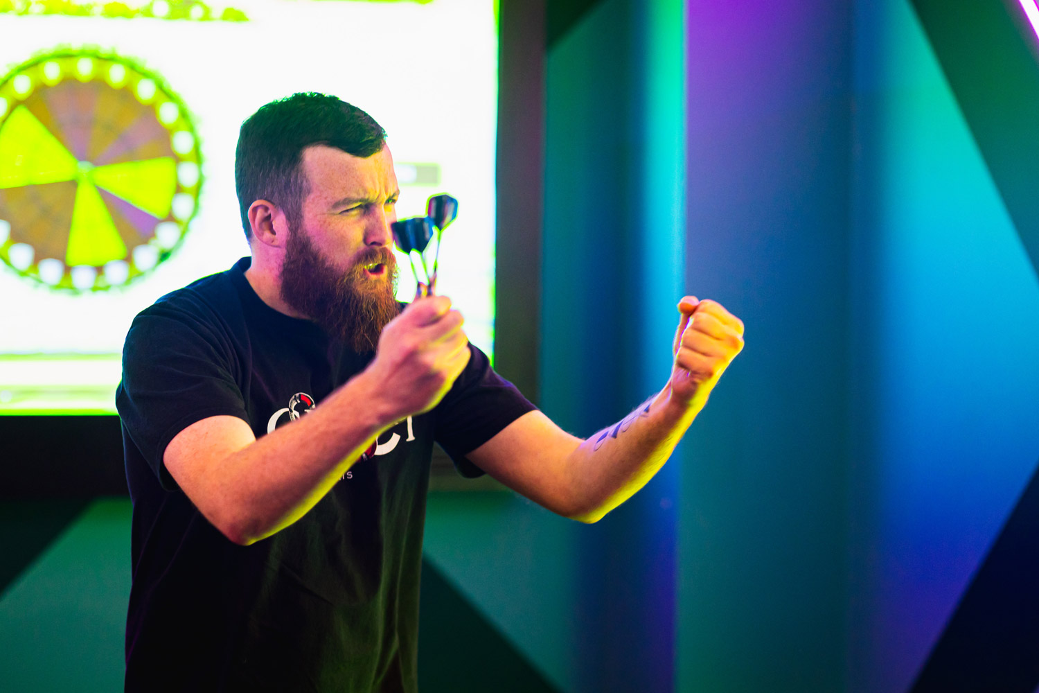 Man Playing Interactive Darts At Tenpin